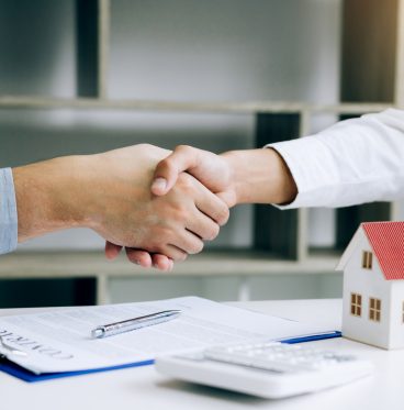 signing contract buying home